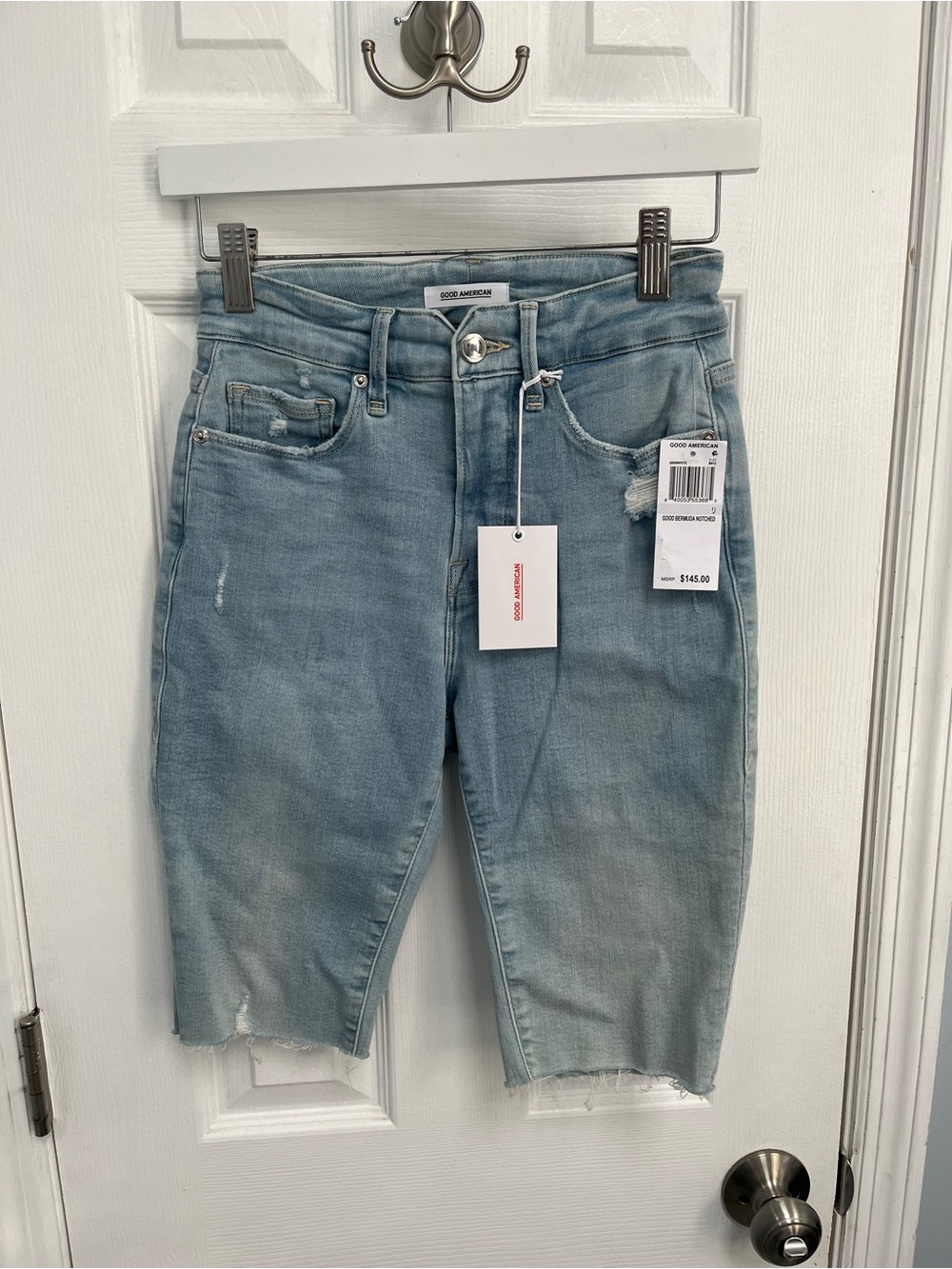 Good American Bermuda denim shorts Jean Light Wash distressed frayed hems 0 25